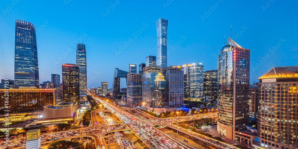 Fototapeta premium High angle night view of the bustling CBD and Guomao Overpass in Beijing, China