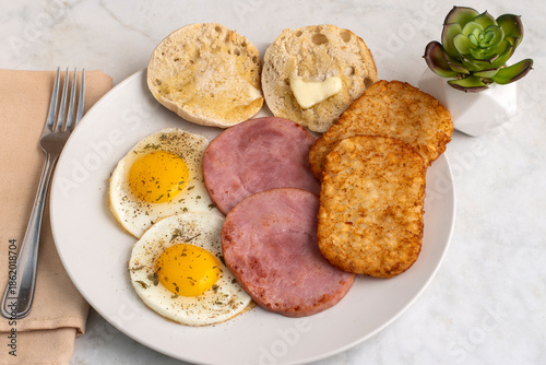fried eggs  with ham and  english muffin