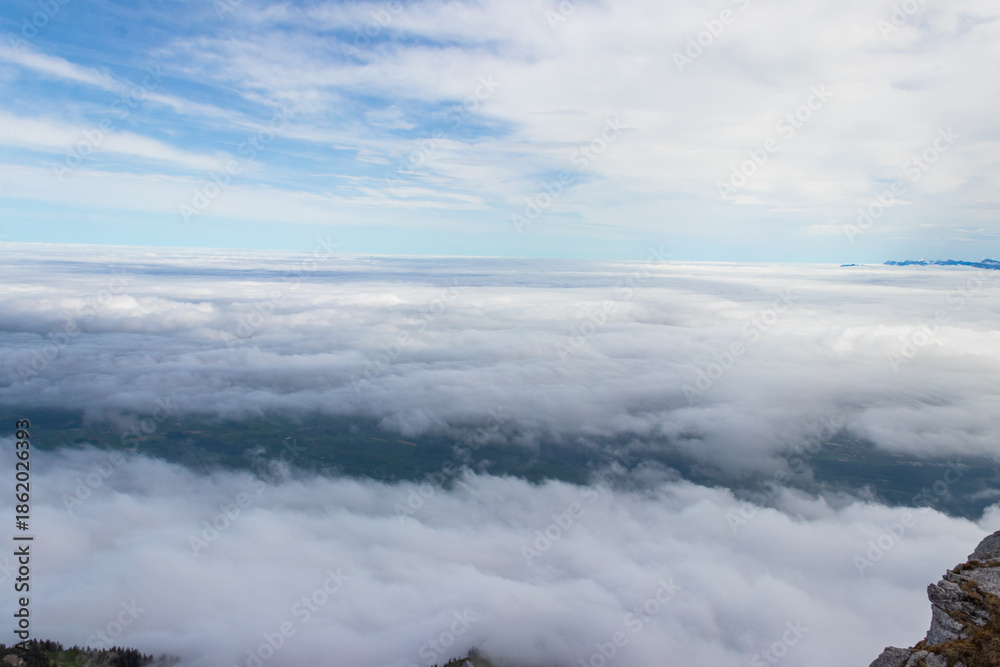 Fototapeta premium View over clouds from Stockhorn mountain in Bernese Oberland, Switzerland