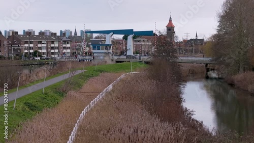Aerial view of Sint Petrus Banden church and Weespertrekvaart canal in the city of Diemen, The Netherlands