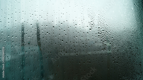 Fotografie Close-up of Condensation Drops Forming on Glass Window Surface
