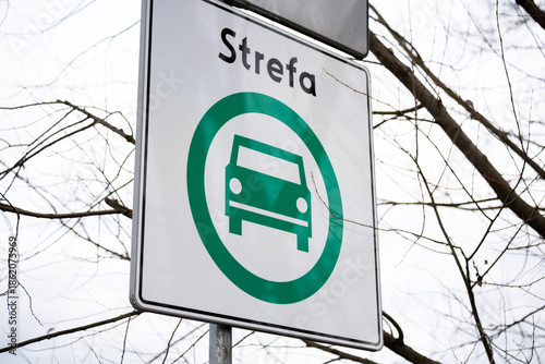 D-54 road sign for the Clean Transport Zone (SCT, Strefa Czystego Transportu) in Krakow, Poland. Ban on older cars from city streets to reduce pollution, effective January 1, 2026. Strefa means Zone.