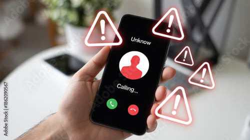 Incoming call with warning signs on a smartphone screen potential scam alert