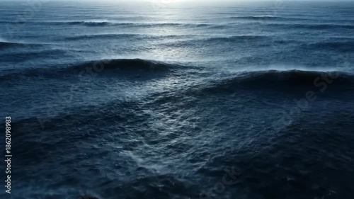 Stormy ocean view with dark waves and horizon; seascape