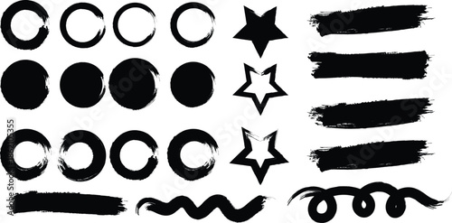 A collection of various black ink brush strokes and shapes on a white background