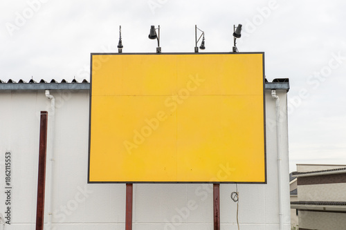 Large blank billboard on a street wall, banners with room to add your own text