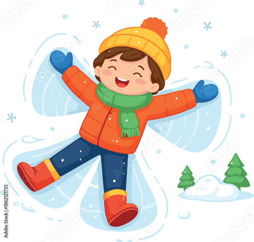 Happy child making a snow angel in the winter outdoors