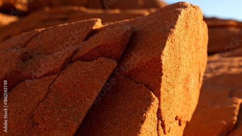 Close up of orange red rock formation under sunlight
