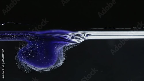 Abstract fluid dynamics a swirling mix of blue and white paint in water