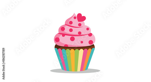 Sweet pink cupcake with red polka dots and a small heart on top set in a colorful striped paper liner on a white background.