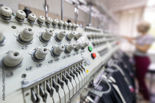 Stitching logos on restaurant uniforms with embroidery machine