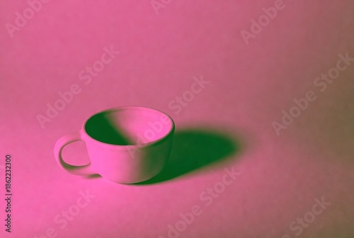 Minimalist Artistry: Empty Porcelain Ceramic Cup on Smooth Surface with Pink Shadow - Modern Aesthetics in Contemporary Interior Design Photography