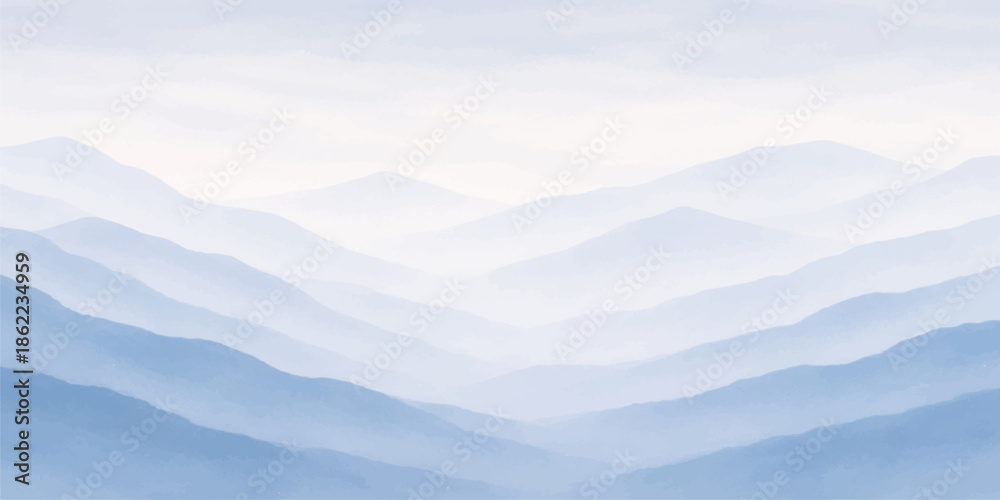 Fototapeta premium Misty mountain landscape with clouds at sunrise over a snowy forest valley where fog and haze meet the morning horizon under a blue winter sky