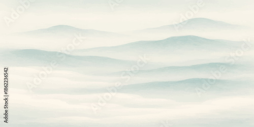 A breathtaking nature landscape of misty blue mountains under a summer sunset sky with soft clouds drifting over the forest hills and dawn fog in the valley