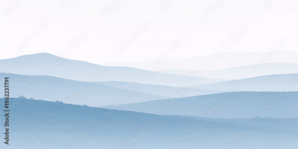 Obraz premium A breathtaking sunrise illuminates a misty mountain landscape as golden light filters through morning fog and clouds over the snowy forest hills and valley at dawn
