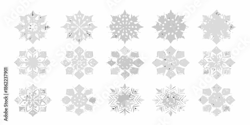 An assortment of delicate gray snowflake designs arranged on a white background