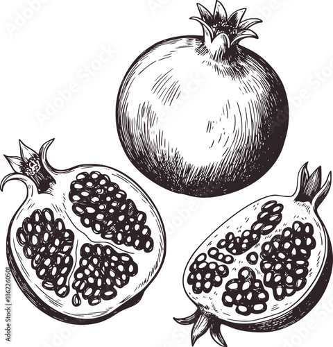 Three black and pomegranates one whole and two cut open