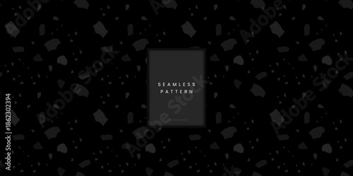 Abstract seamless terrazzo pattern featuring organic stone fragments and chips in dark monochrome grey on a black background