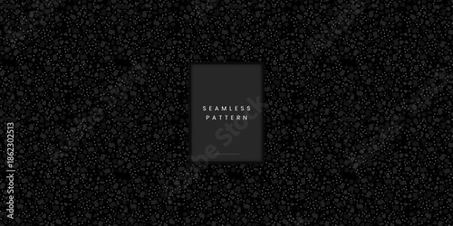 Minimalist seamless terrazzo pattern featuring tiny organic stone granules or sand chips in dark monochrome grey on a black background