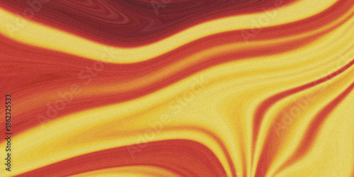 Фотография A vibrant abstract swirl of warm colors featuring flowing red and golden yellow