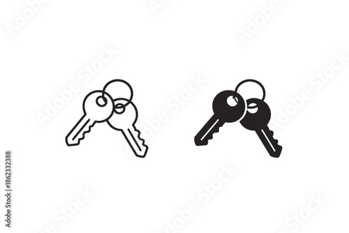 Two keys on a keyring, one outlined and one solid black, isolated on white background