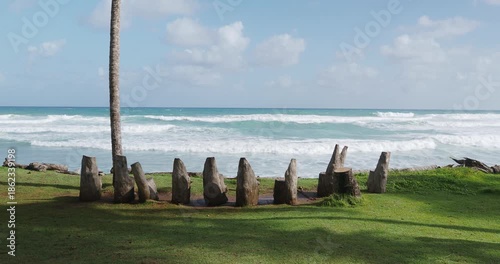 Wooden chairs on ocean shore with beautiful view.