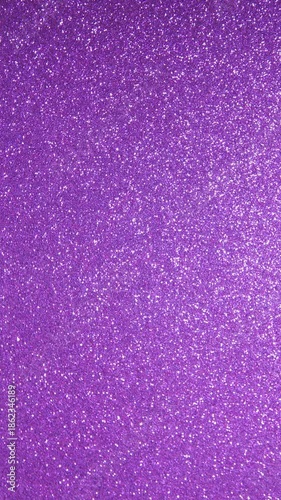 Vertical video background with a glittering purple surface. 