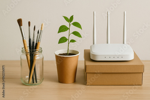 Brushes, a sprout and a router on a light background.