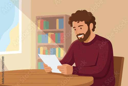 Smiling bearded man with curly hair reading a document while sitting at a wooden table in a cozy room with a bookshelf and window in the background