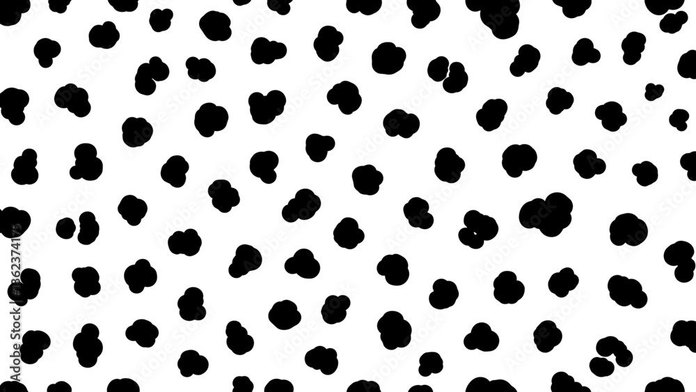 Fototapeta premium Abstract black spots scattered randomly on a bright white background, creating a pattern.