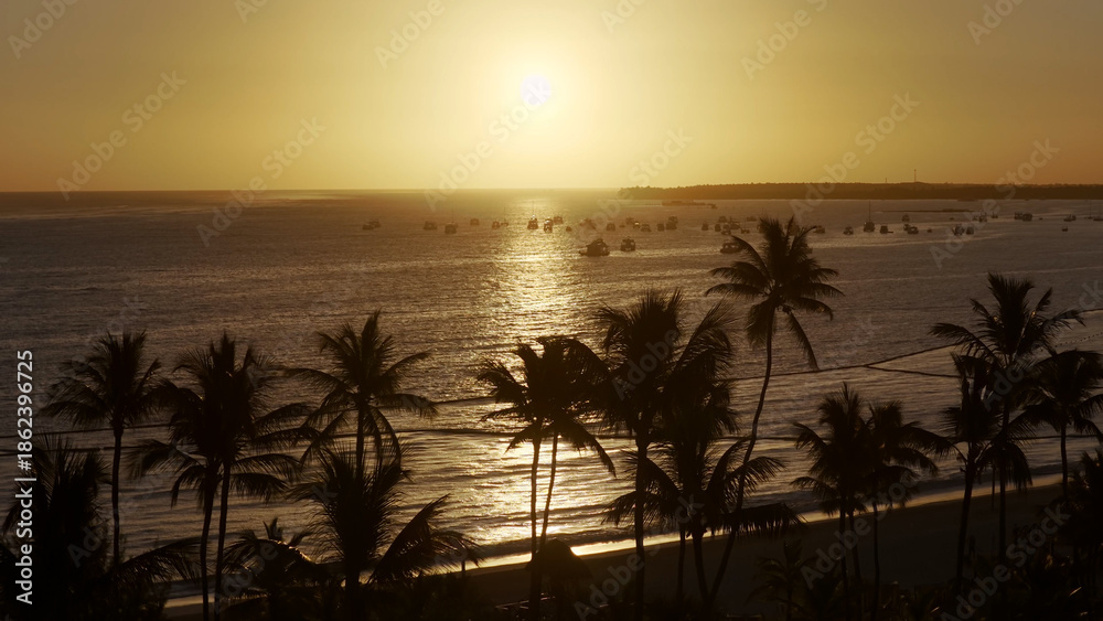 Obraz premium Sunset Beach At Punta Cana In La Altagracia Dominican Republic. Sunset Landscape. Beachfront Resorts. Travel Destinations. Sunset Beach In Punta Cana In La Altagracia Dominican Republic. 