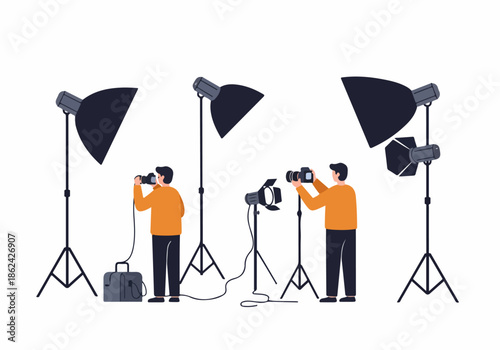 Professional photographers at work in a studio, setting up lighting and cameras. Two men capture images using softboxes and strobes, depicting a photography session.