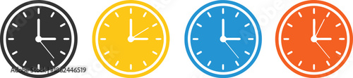 Four colorful clocks side by side on white background