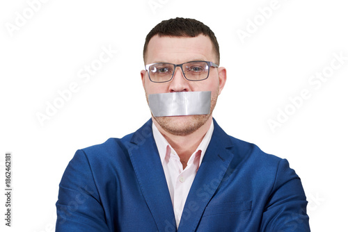 Foto man has a big piece of black industrial tape covering his mouth, silence concept