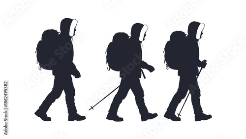 Hikers walking in a line with backpacks and trekking poles