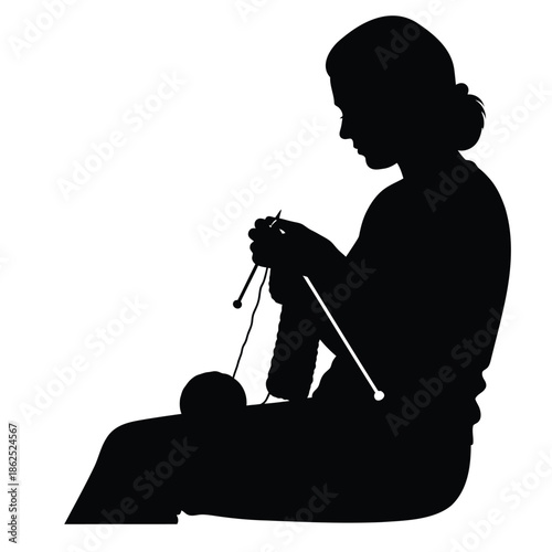 Woman knitting silhouette with needles and yarn