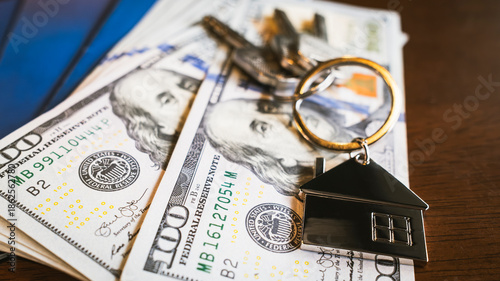 Φωτογραφία Real estate finance concept with house keychain and keys placed on money bills