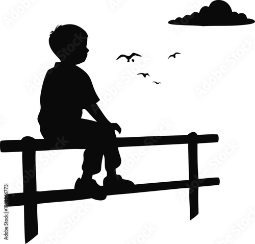 Boy Sitting On A Fence Watching A Sunset