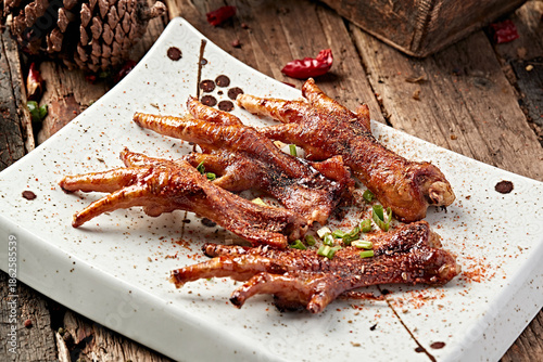 Charcoal-grilled raw chicken feet