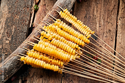 Charcoal-grilled corn kernel skewers