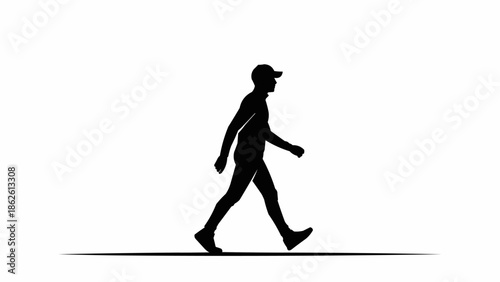 Silhouette of a man walking forward wearing a baseball cap.