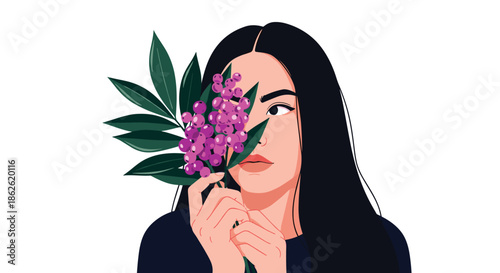 Young woman with long black hair holding a branch with small purple berries in front of her face in a creative studio portrait setting.