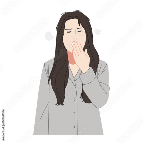 A woman in light gray long-sleeved pajamas who still feels sleepy after a short sleep.