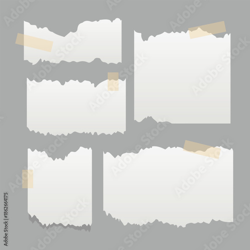 Collection of blank torn paper pieces with tape.