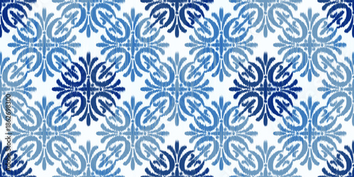 Ikat seamless pattern with floral ethnic motif. Geometric rug textured batik print for textile fabric background. Traditional tribal oriental woven ornament. Decorative grunge folk illustration