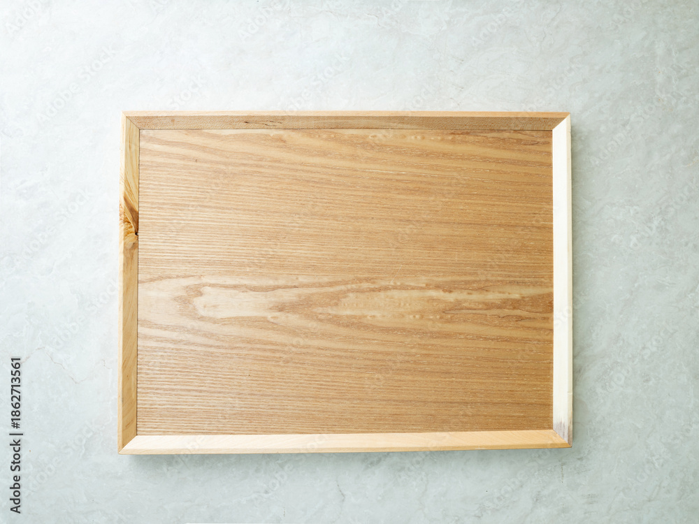 Naklejka premium Wooden tray on a white background