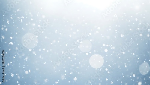 Snowflakes falling on blue background with bokeh effect falling snow 1