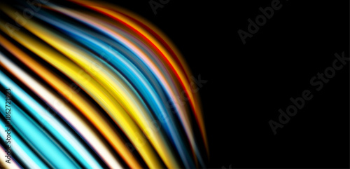 Abstract colorful lines curve across black background. Bright hues create dynamic visual effect, suggesting movement, energy.