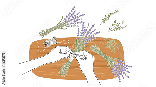 A person's hands are shown tying a string around a bundle of lavender with other prepared bouquets and sprigs on a wooden surface