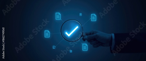 Businessman inspecting documents with magnifying glass for verification